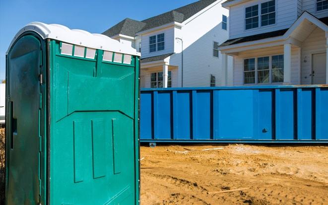 dumpster and portable toilet at a construction site in Pleasant Grove UT